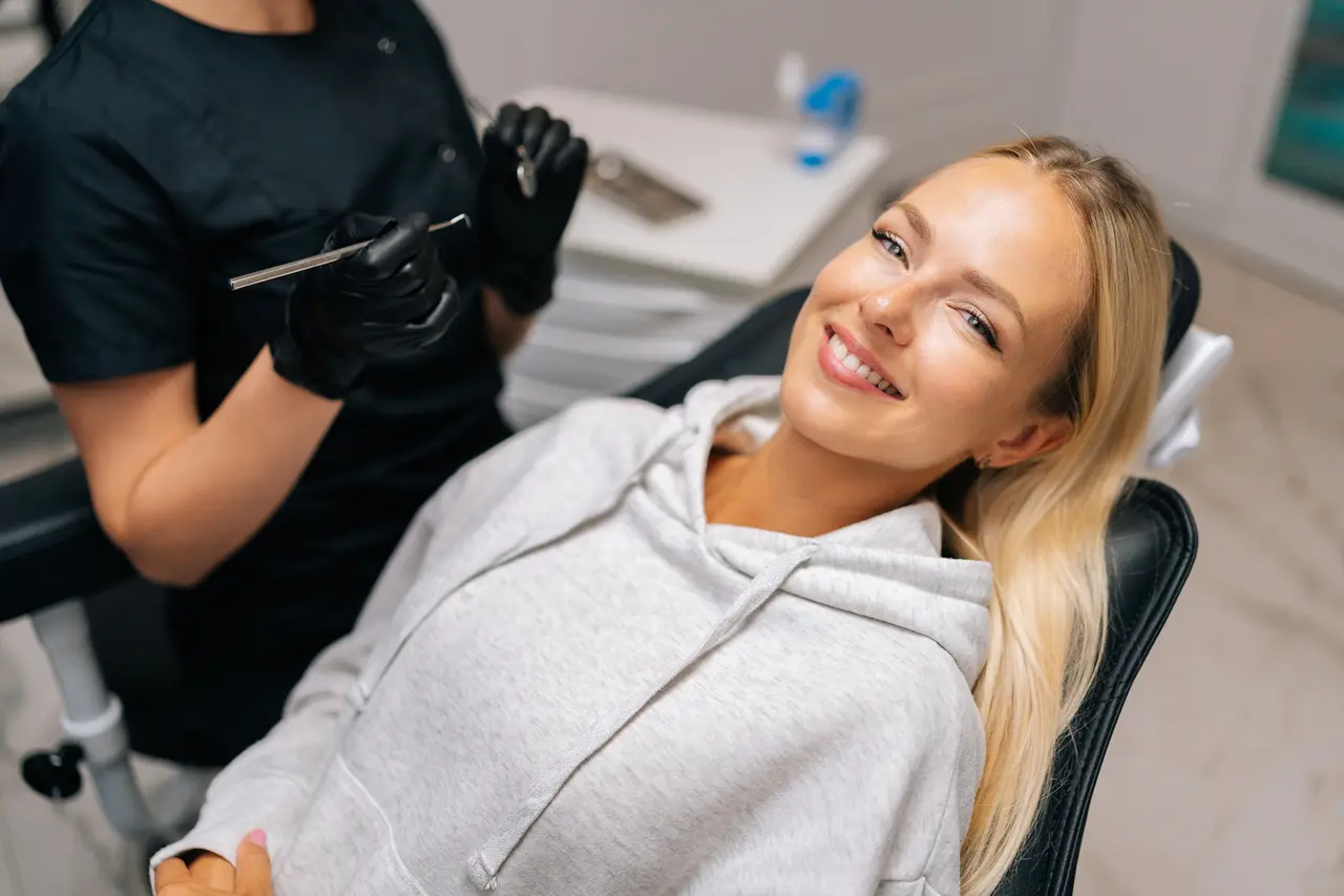 A relaxed, smiling patient receiving gentle endodontic care at Molina Endodontics
