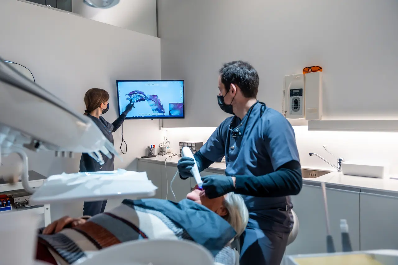 Endodontist reviewing X-rays with a patient during a same-day visit